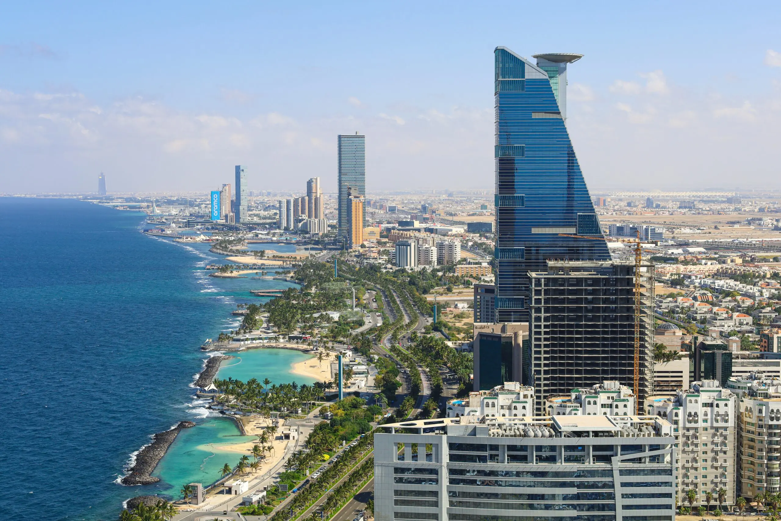 Scenic view of Jeddah Corniche along the Red Sea with palm trees and walking paths