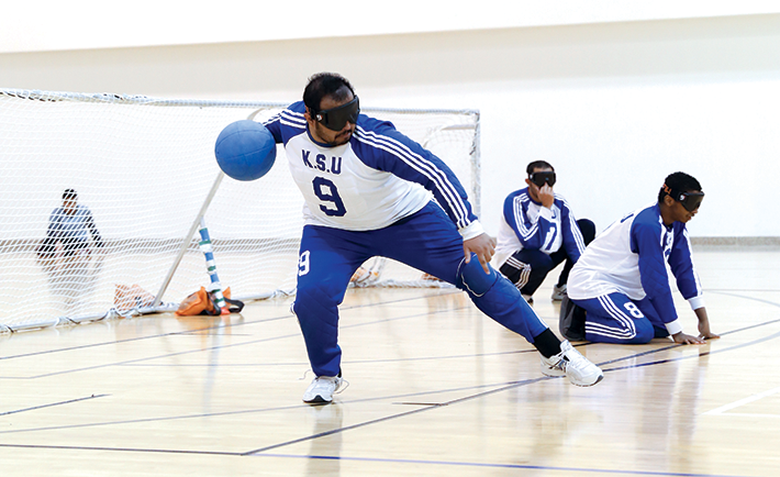 Goal ball is a sport for the visually impaired using a ball fitted with bells. The Saudi Goal Ball team is the first in the gulf and has won 8 championships.